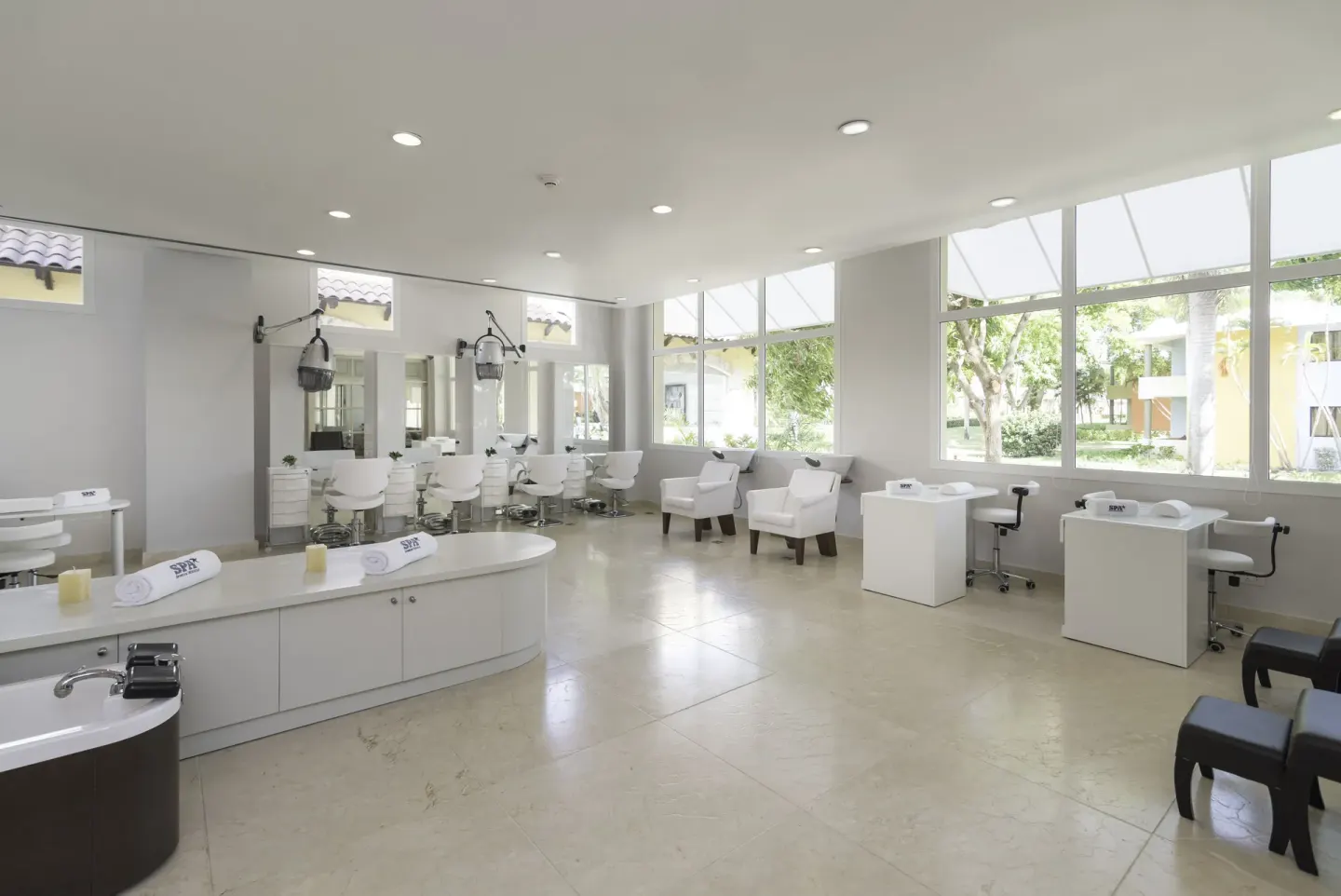 Bright salon stations and pedicure chairs at Iberostar Selection Bávaro Suites.