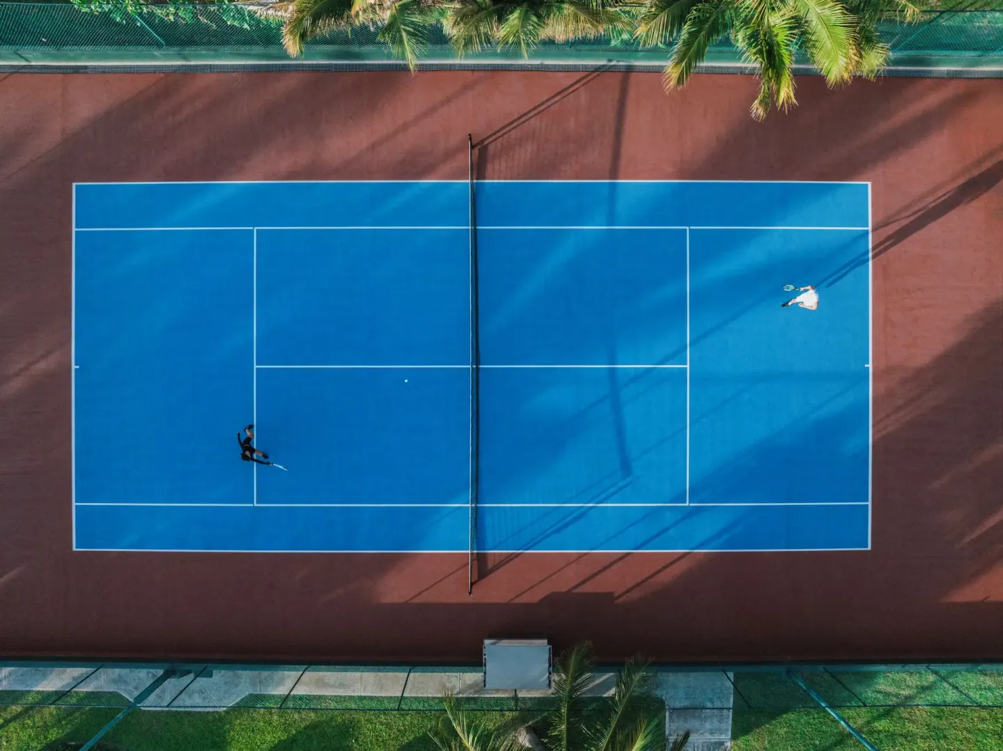 Aerial view of a blue tennis court at Iberostar Selection Cancún.