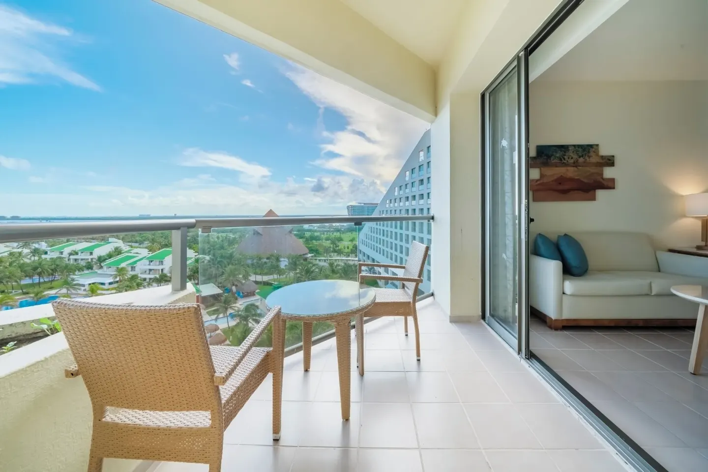 Premium Room balcony with ocean view seating at Iberostar Selection Cancún.