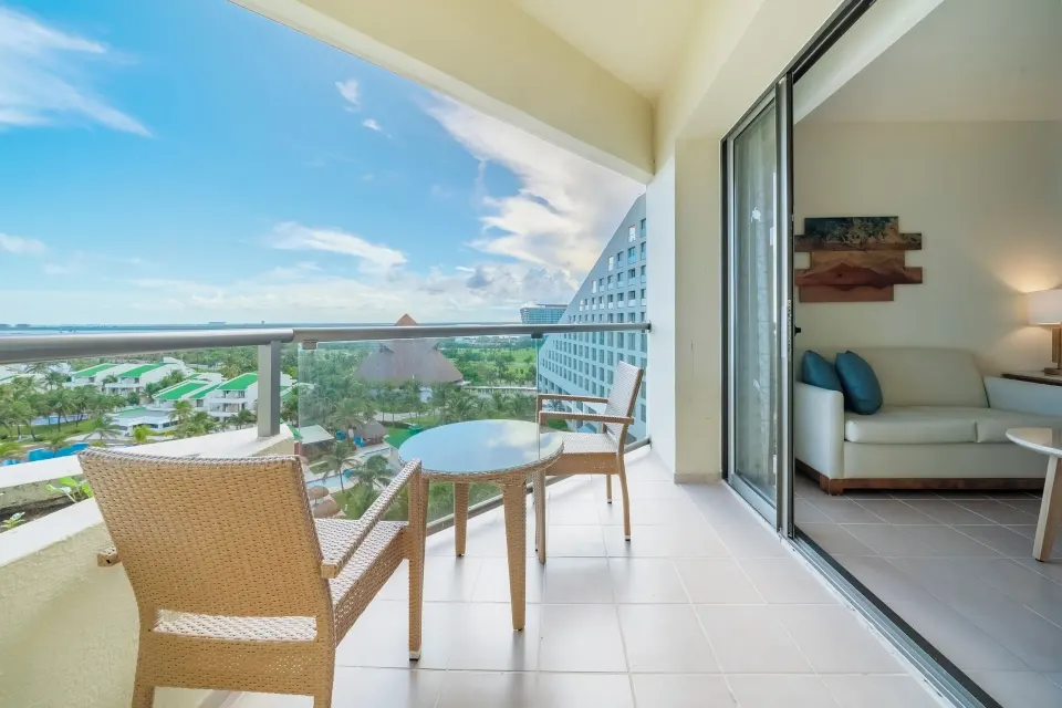 Premium Room balcony with ocean view seating at Iberostar Selection Cancún.