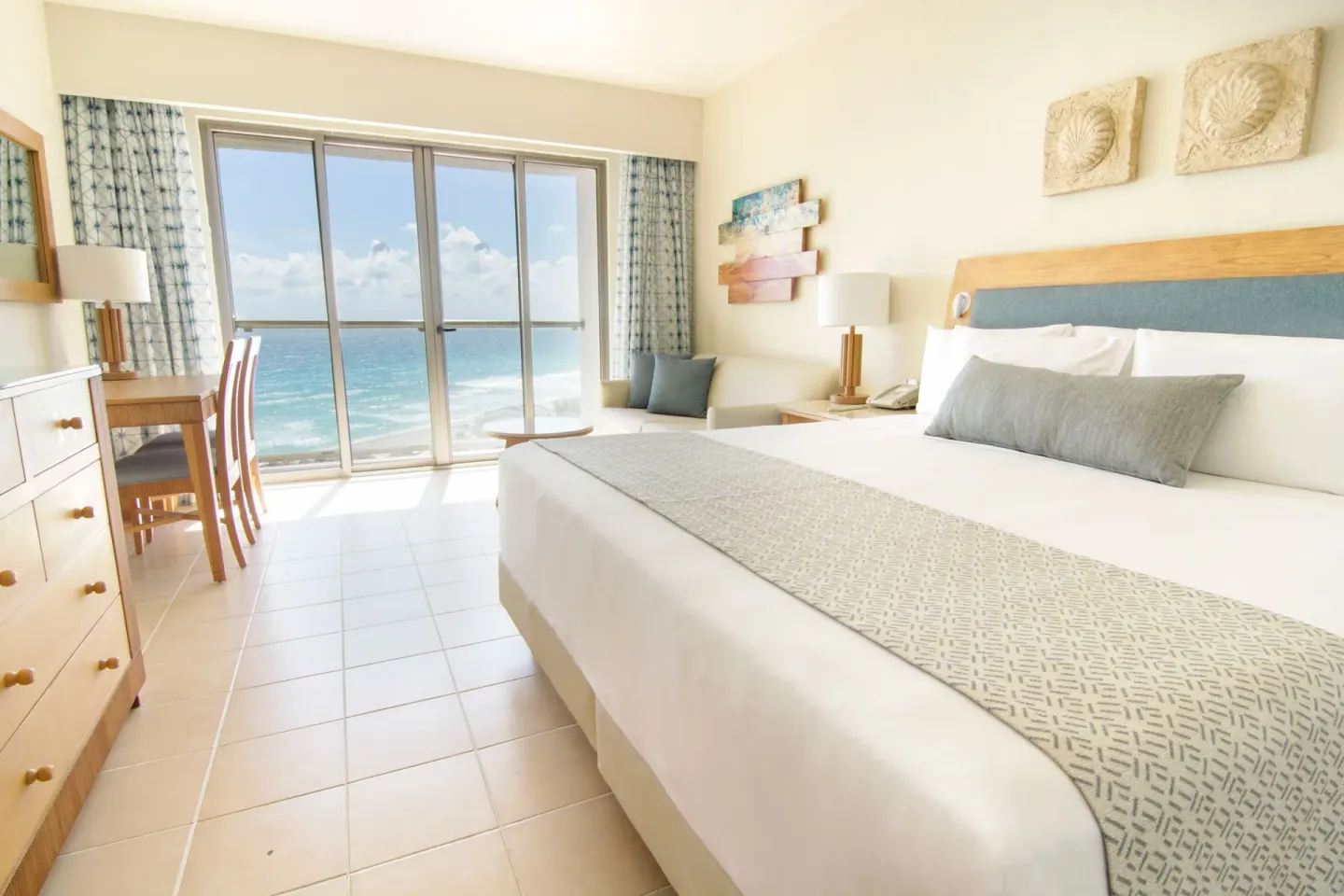 Premium Room ocean view with king bed and balcony doors at Iberostar Selection Cancún.
