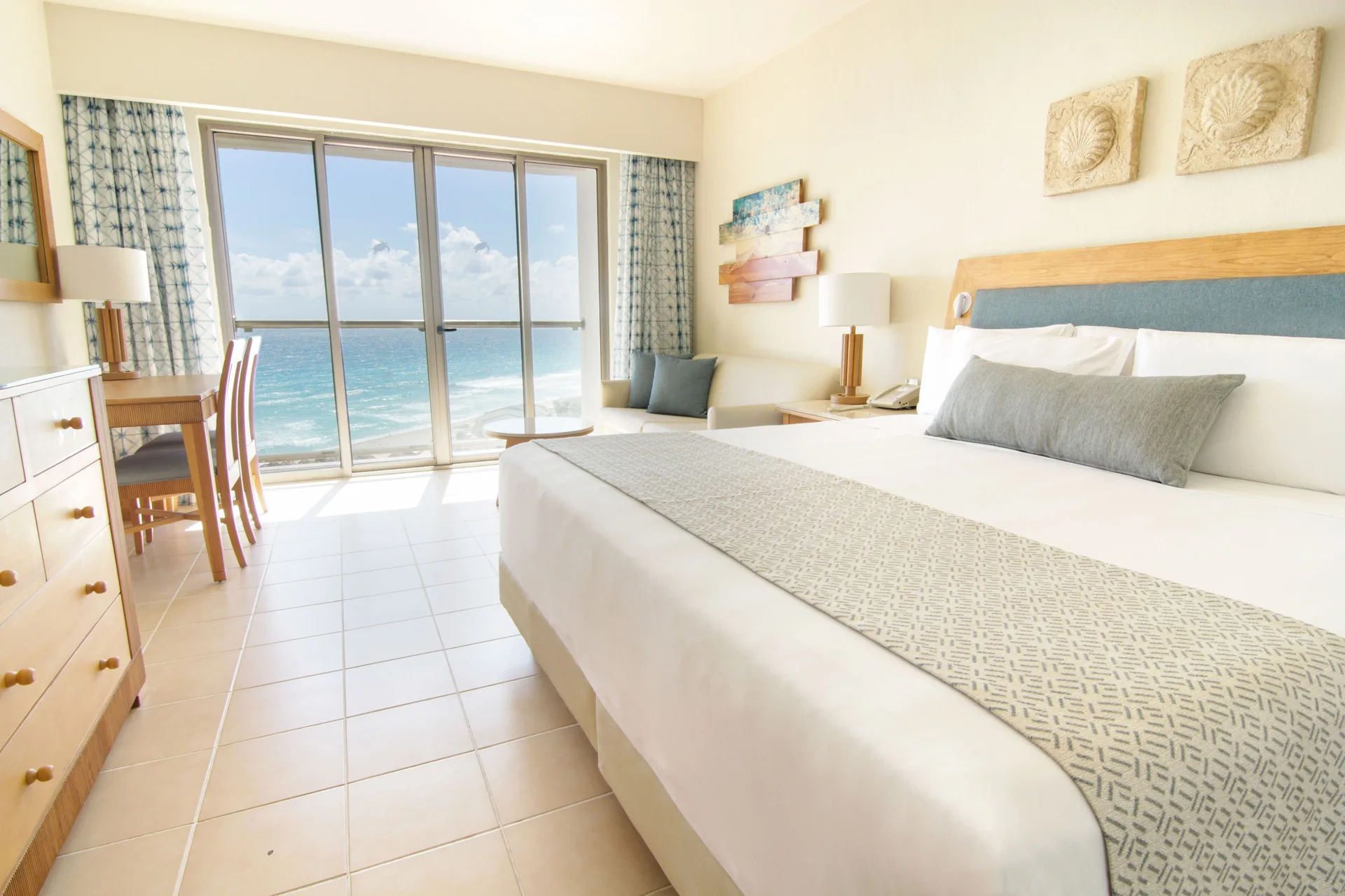 Premium Room ocean view with king bed and balcony doors at Iberostar Selection Cancún.