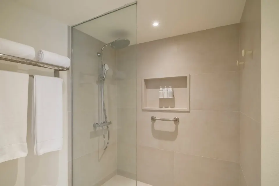 Oceanfront suite bathroom shower and towels at Iberostar Selection Cancún