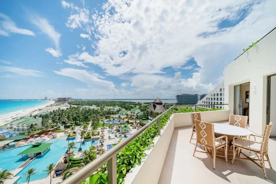Oceanfront suite terrace with beach and pool views at Iberostar Selection Cancún