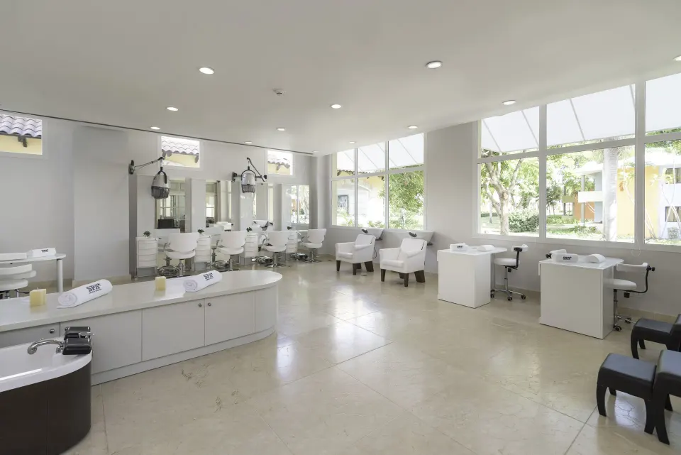 Bright salon area with styling chairs and pedicure stations at Iberostar Selection Coral Bávaro.