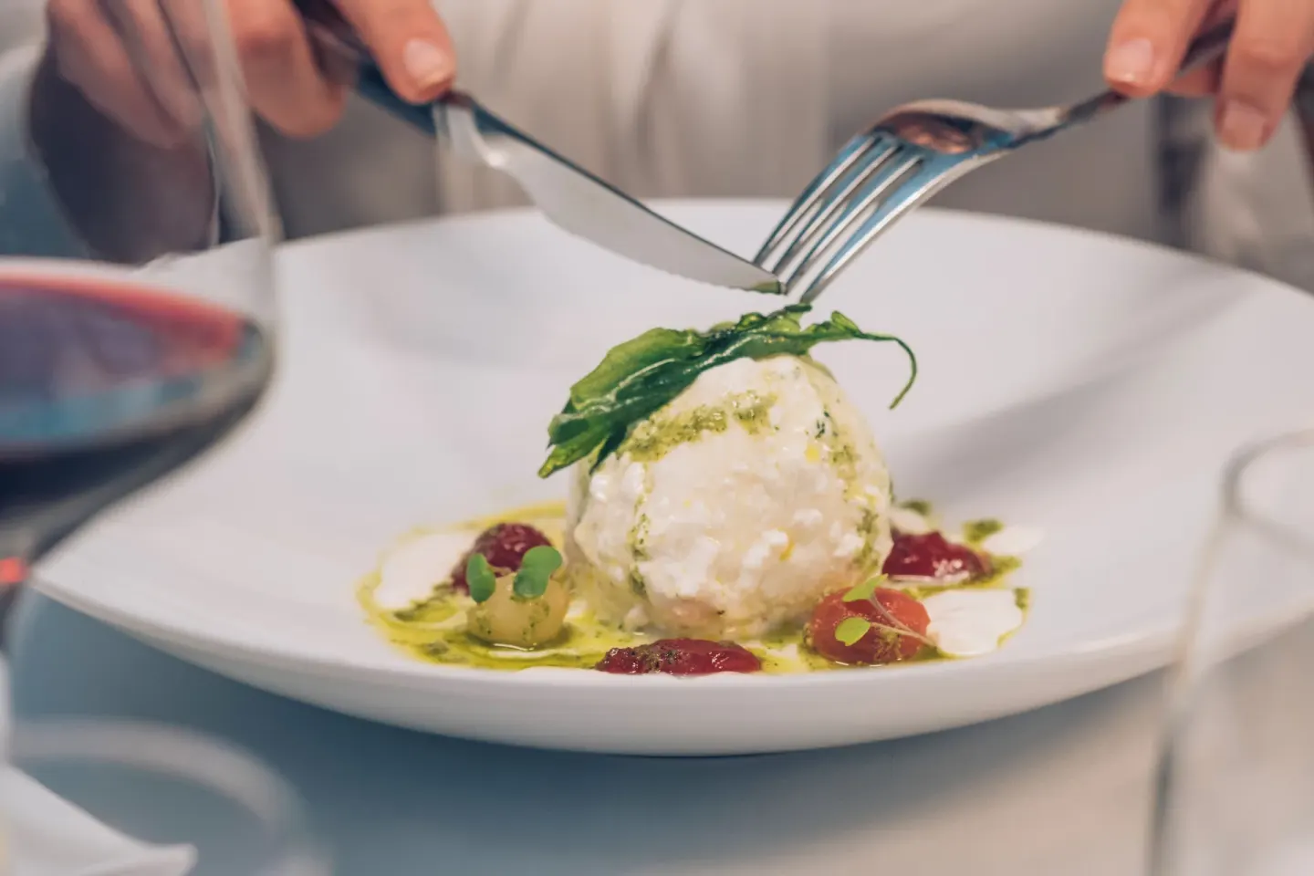 Close-up of a plated dish being cut at Iberostar Selection Coral Bávaro.