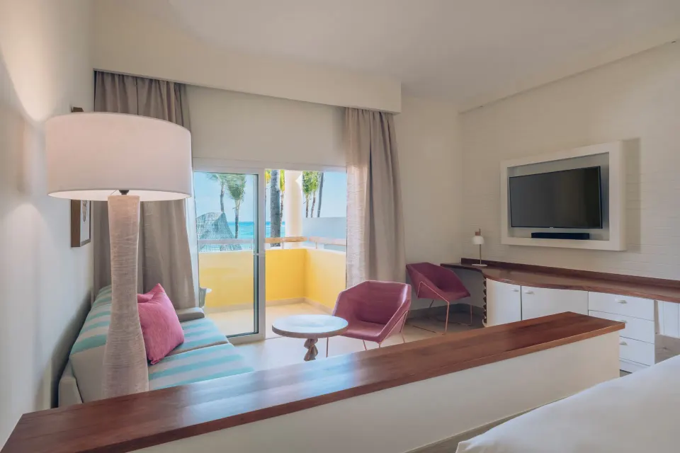 Junior Suite Oceanfront sitting area and balcony at Iberostar Selection Coral Bávaro.
