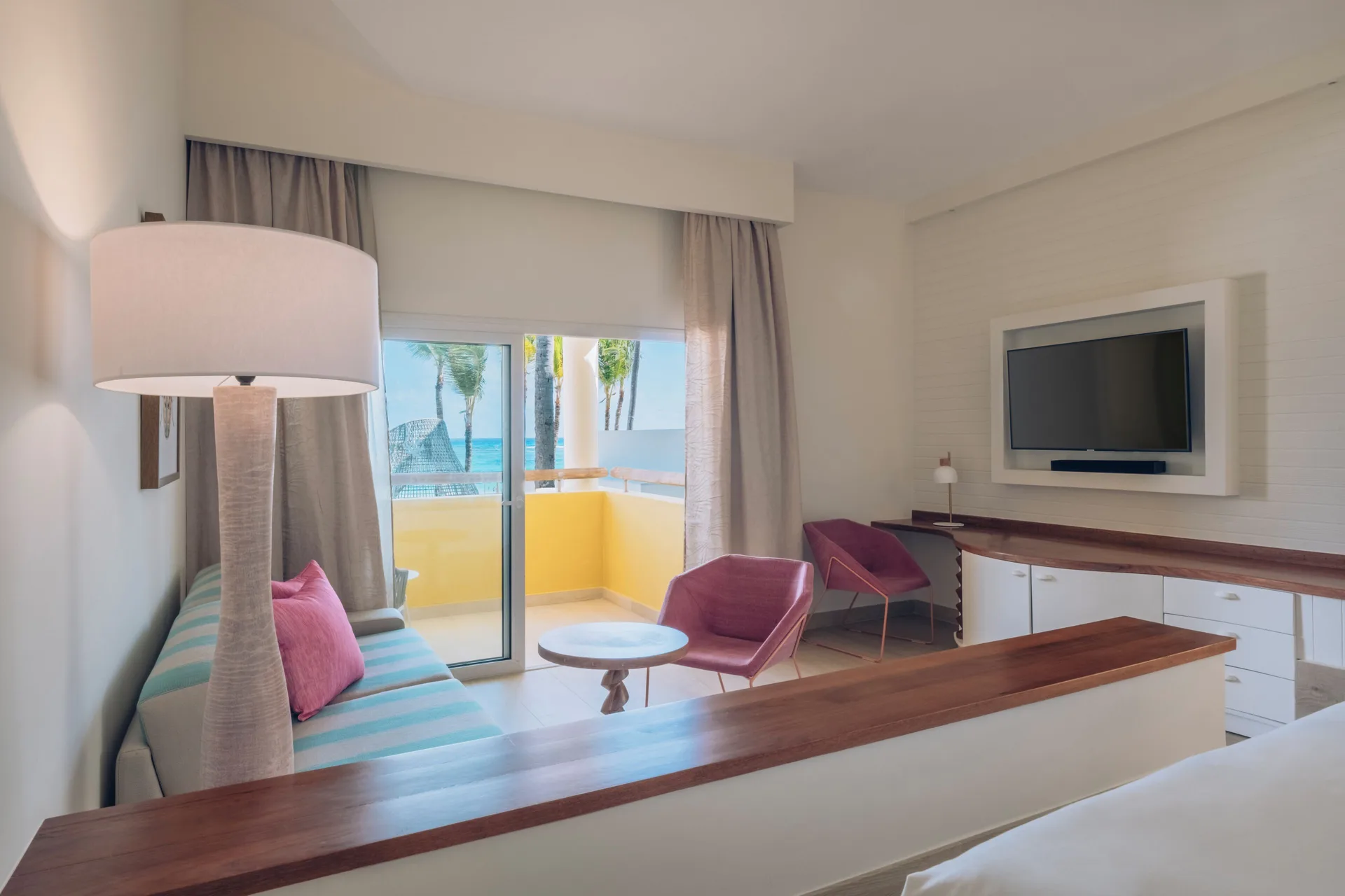 Junior Suite Oceanfront sitting area and balcony at Iberostar Selection Coral Bávaro.