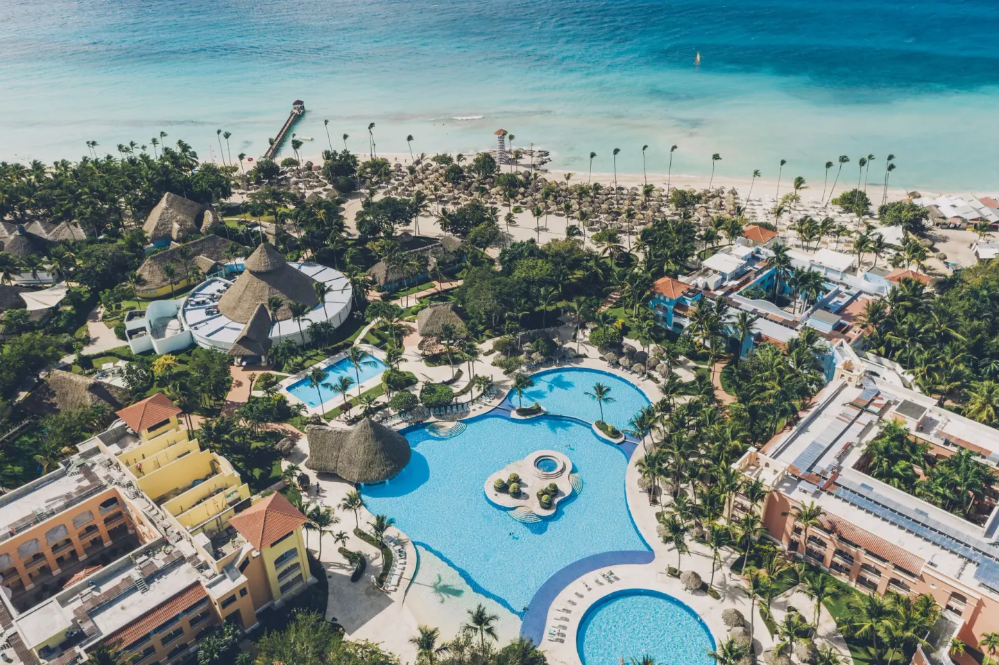 Aerial view of pools, gardens, beach, and sea at Iberostar Selection Hacienda Dominicus.