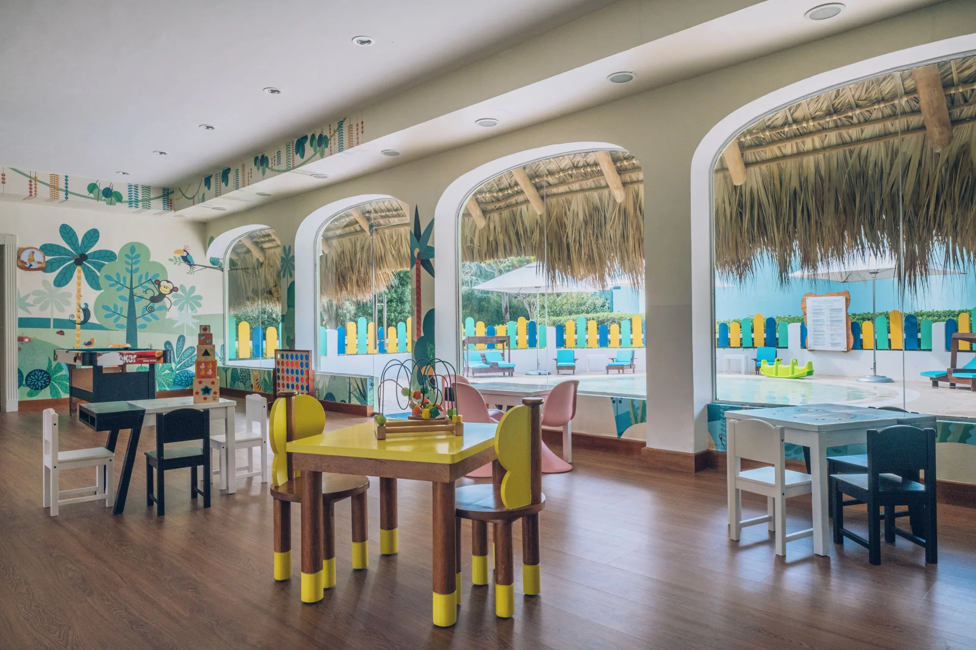 Children's playroom with small tables at Iberostar Selection Hacienda Dominicus.