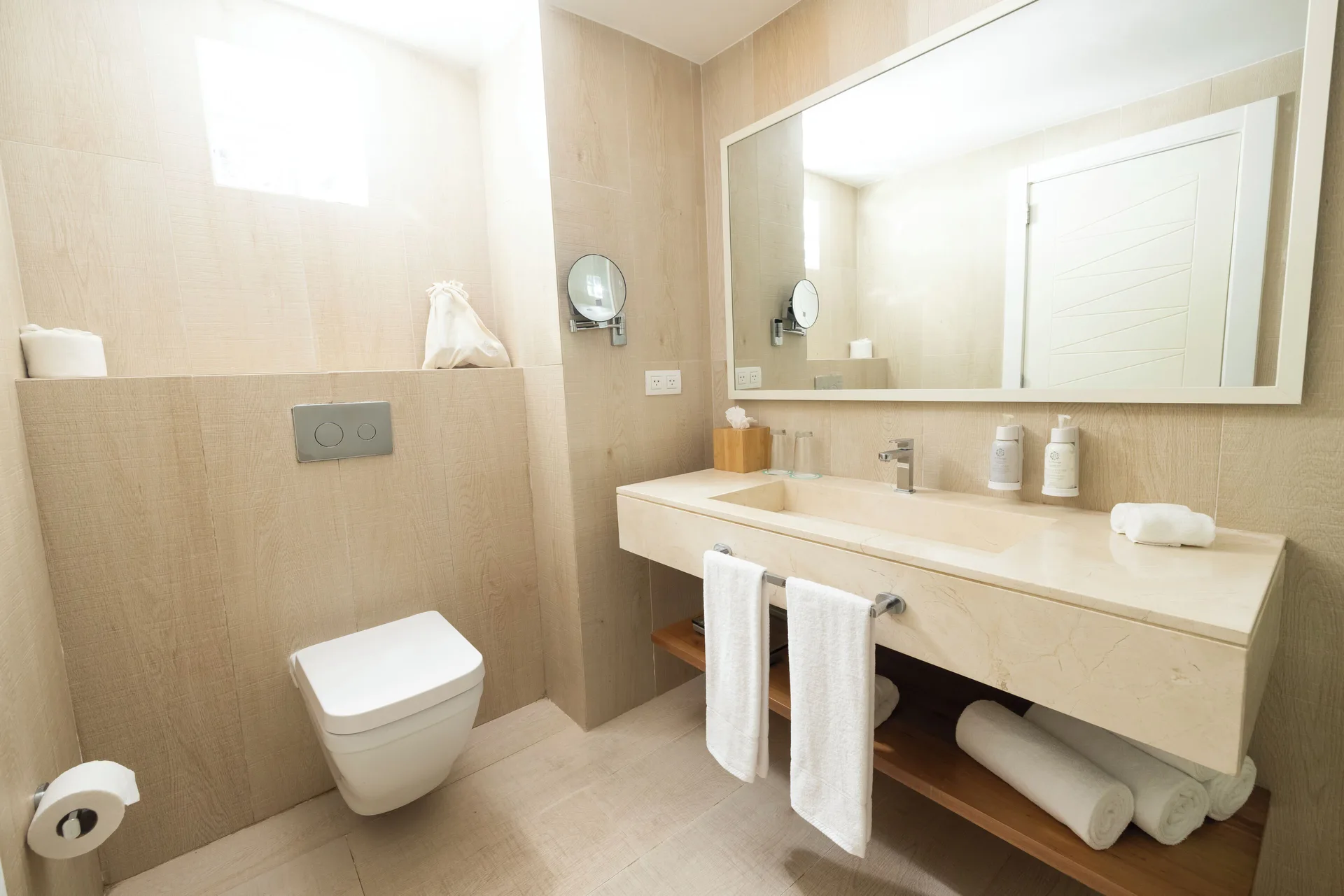 Guest bathroom with sink vanity and toilet at Iberostar Selection Hacienda Dominicus.