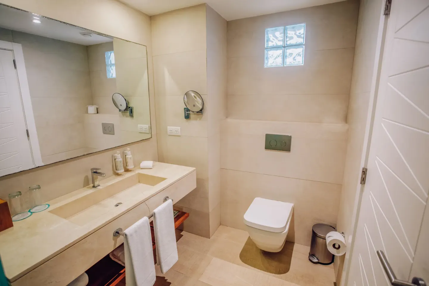 Guest bathroom vanity and toilet at Iberostar Selection Hacienda Dominicus.