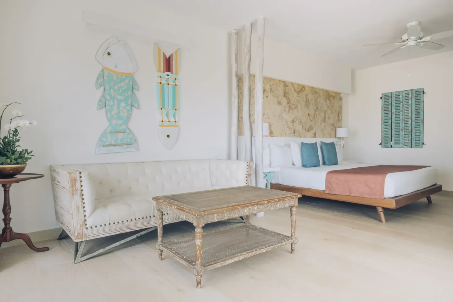 Guest room with king bed and sofa at Iberostar Selection Hacienda Dominicus.