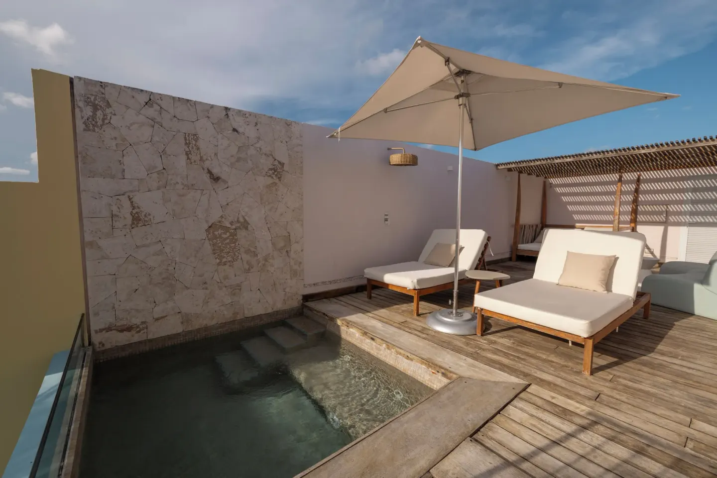 Private plunge pool terrace with loungers at Iberostar Selection Hacienda Dominicus.