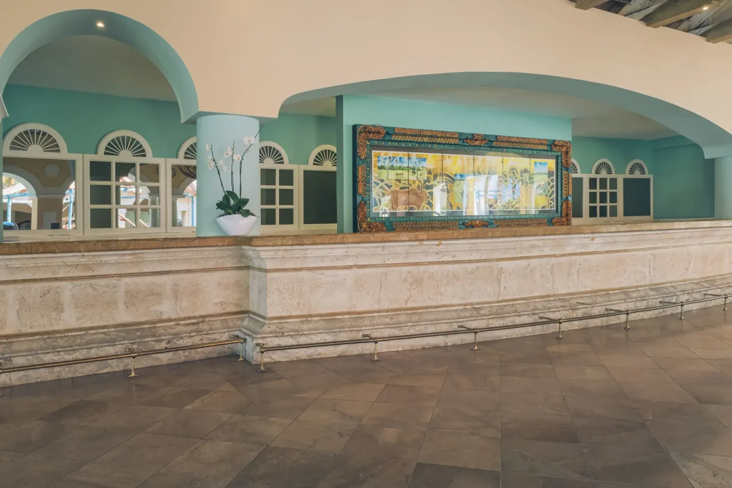 Turquoise reception counter area at Iberostar Selection Hacienda Dominicus.