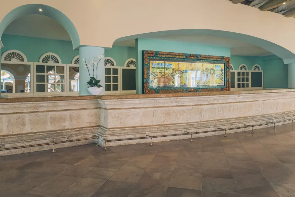 Turquoise reception counter area at Iberostar Selection Hacienda Dominicus.