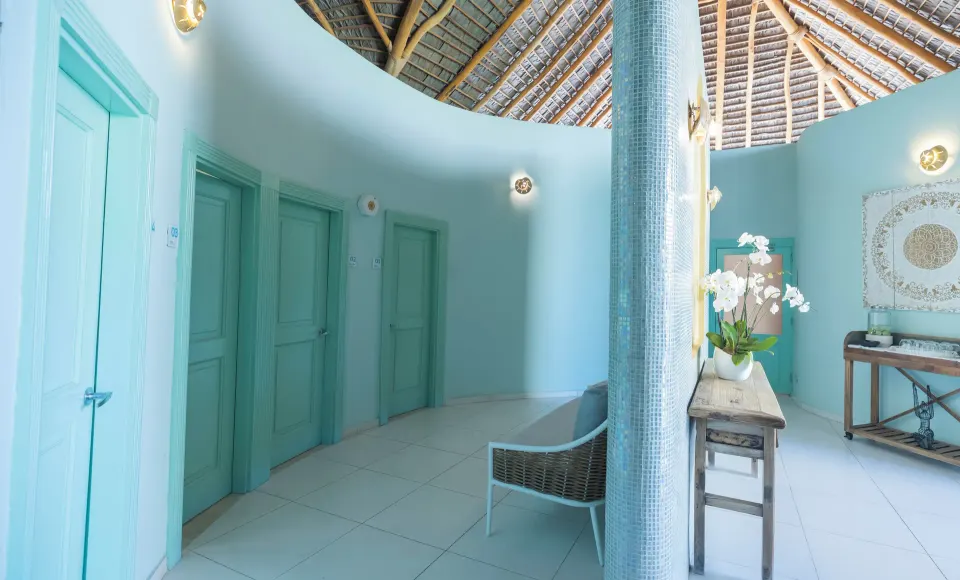 Spa corridor with turquoise doors at Iberostar Selection Hacienda Dominicus.