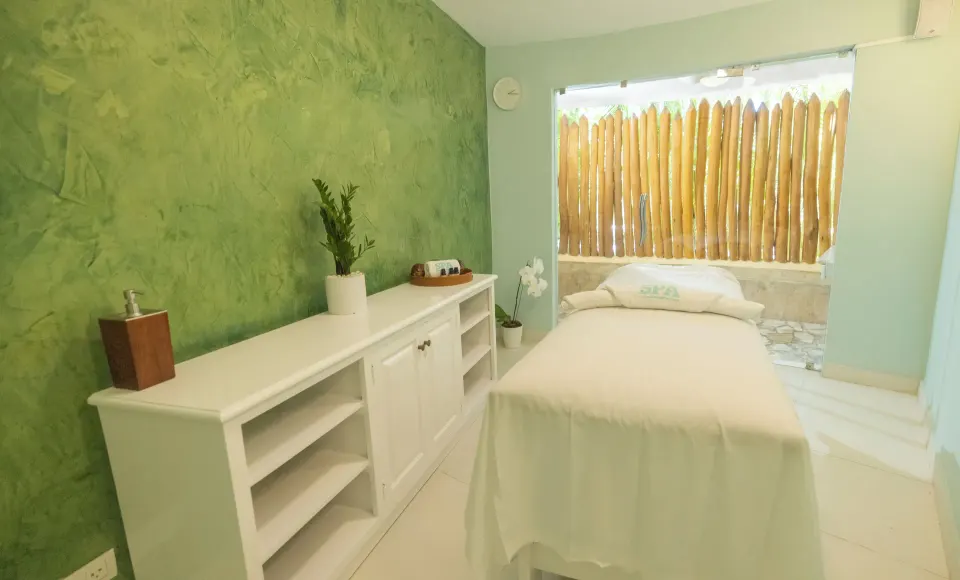 Spa treatment room with massage bed at Iberostar Selection Hacienda Dominicus.