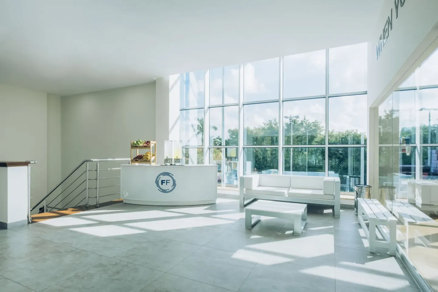 Modern fitness lounge with reception desk and seating at Iberostar Selection Paraíso Lindo.