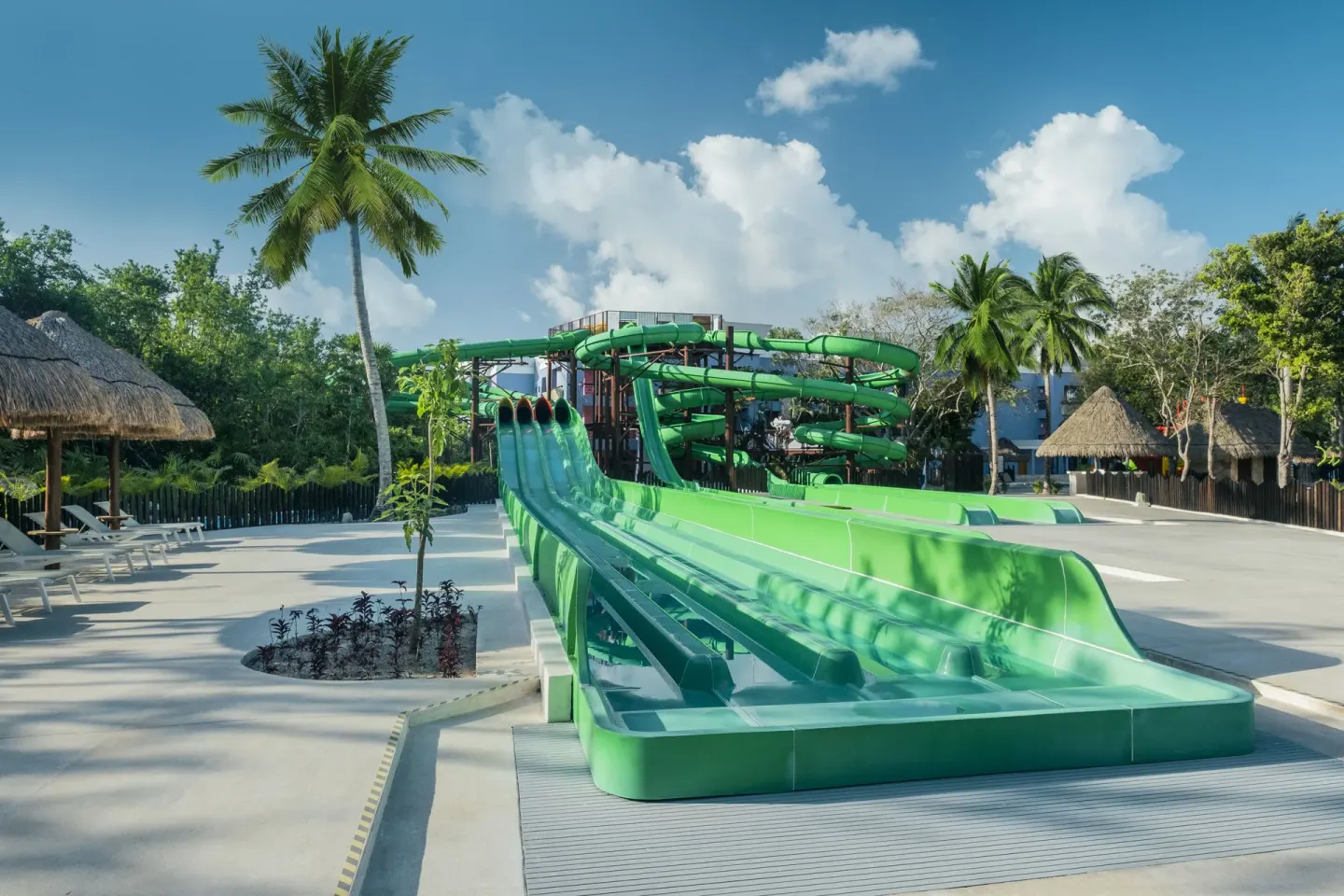 Racing waterslides with palapas and loungers at Iberostar Selection Paraíso Lindo.