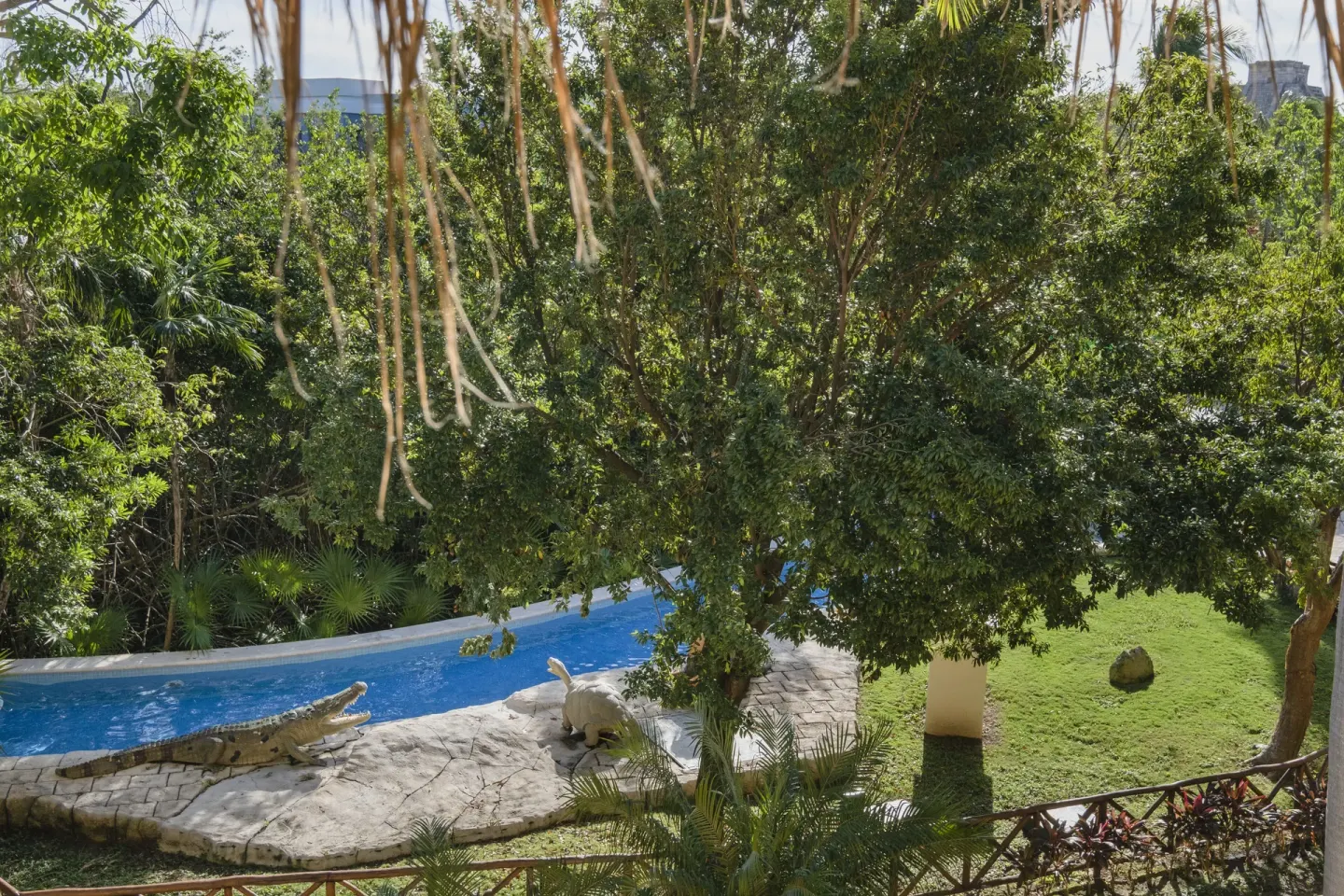 Premium room garden view with water and animal sculptures at Iberostar Selection Paraíso Lindo.