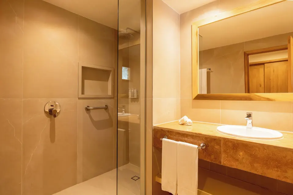 Premium Room near Beach bathroom with shower and vanity at Iberostar Selection Paraíso Lindo.