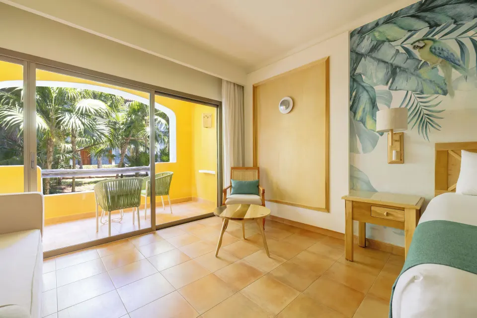 Premium Room near Beach seating area and balcony at Iberostar Selection Paraíso Lindo.