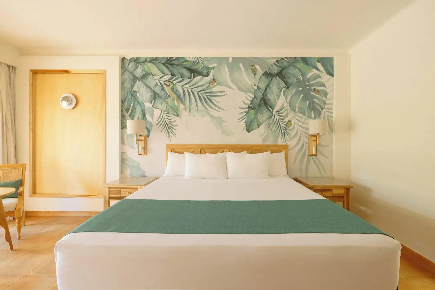 Premium Room near Beach king bed and tropical mural at Iberostar Selection Paraíso Lindo.