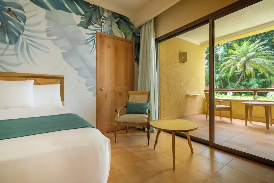 Premium Room pure Wellness bed beside a terrace at Iberostar Selection Paraíso Lindo.