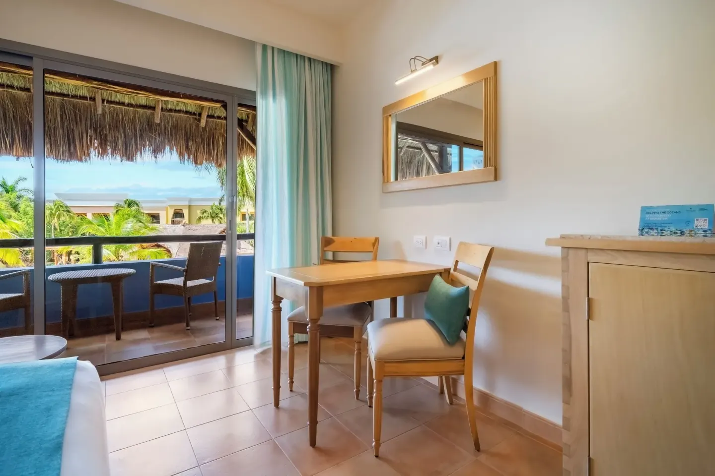 Premium Room pure Wellness sitting area and balcony at Iberostar Selection Paraíso Lindo.