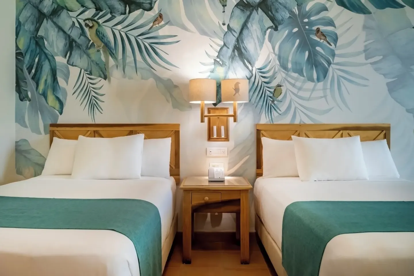 Premium Room pure Wellness with two beds and tropical mural at Iberostar Selection Paraíso Lindo.