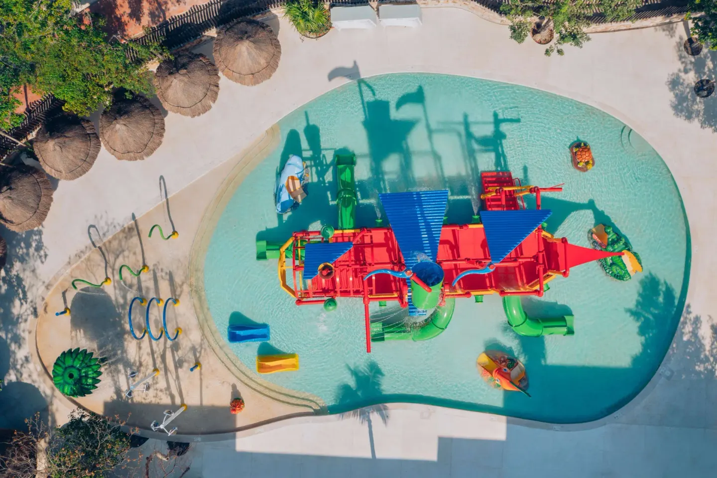 Aerial view of the children's splash pool at Iberostar Selection Paraíso Maya Suites.