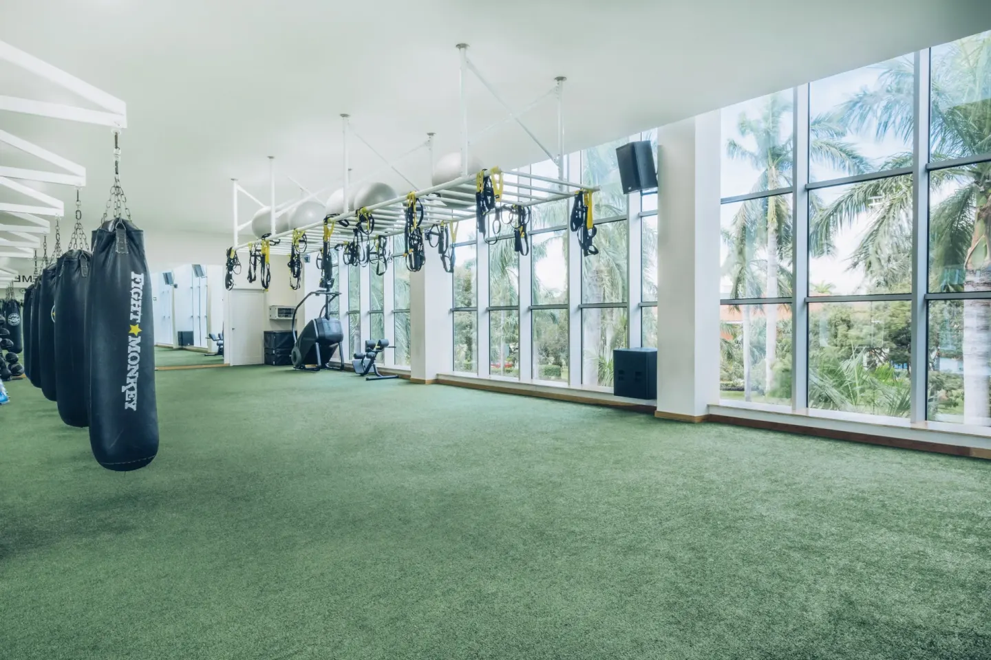 Training room with punching bags and suspension straps at Iberostar Selection Paraíso Maya Suites.