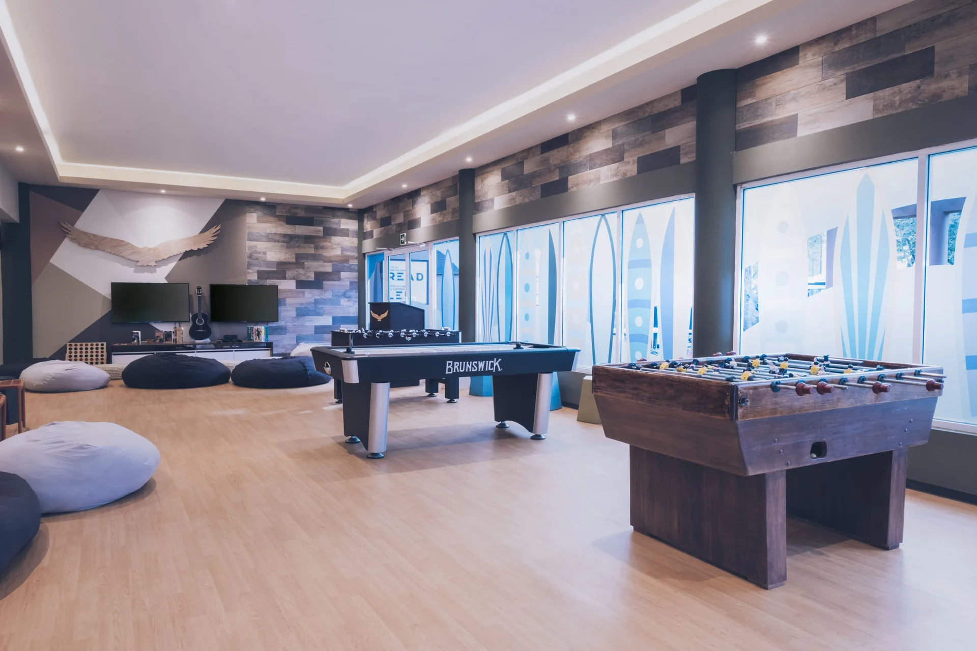 Game lounge with foosball and pool tables at Iberostar Selection Paraíso Maya Suites.
