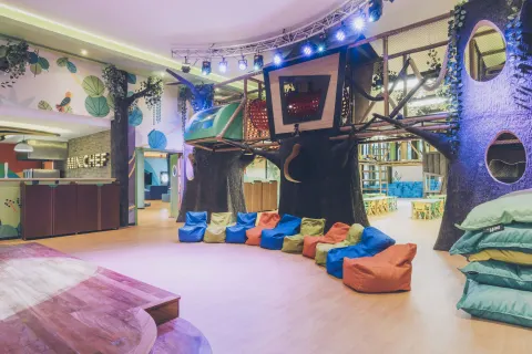 Colorful kids' club treehouse play area at Iberostar Selection Paraíso Maya Suites.