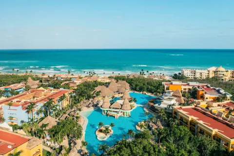 Aerial view of resort pools and the Caribbean coastline at Iberostar Selection Paraíso Maya Suites.