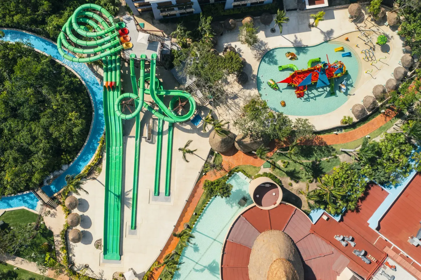 Aerial view of waterslides and splash pool at Iberostar Selection Paraíso Maya Suites.