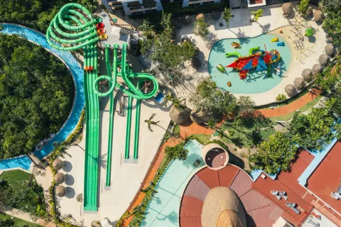 Aerial view of waterslides and splash pool at Iberostar Selection Paraíso Maya Suites.