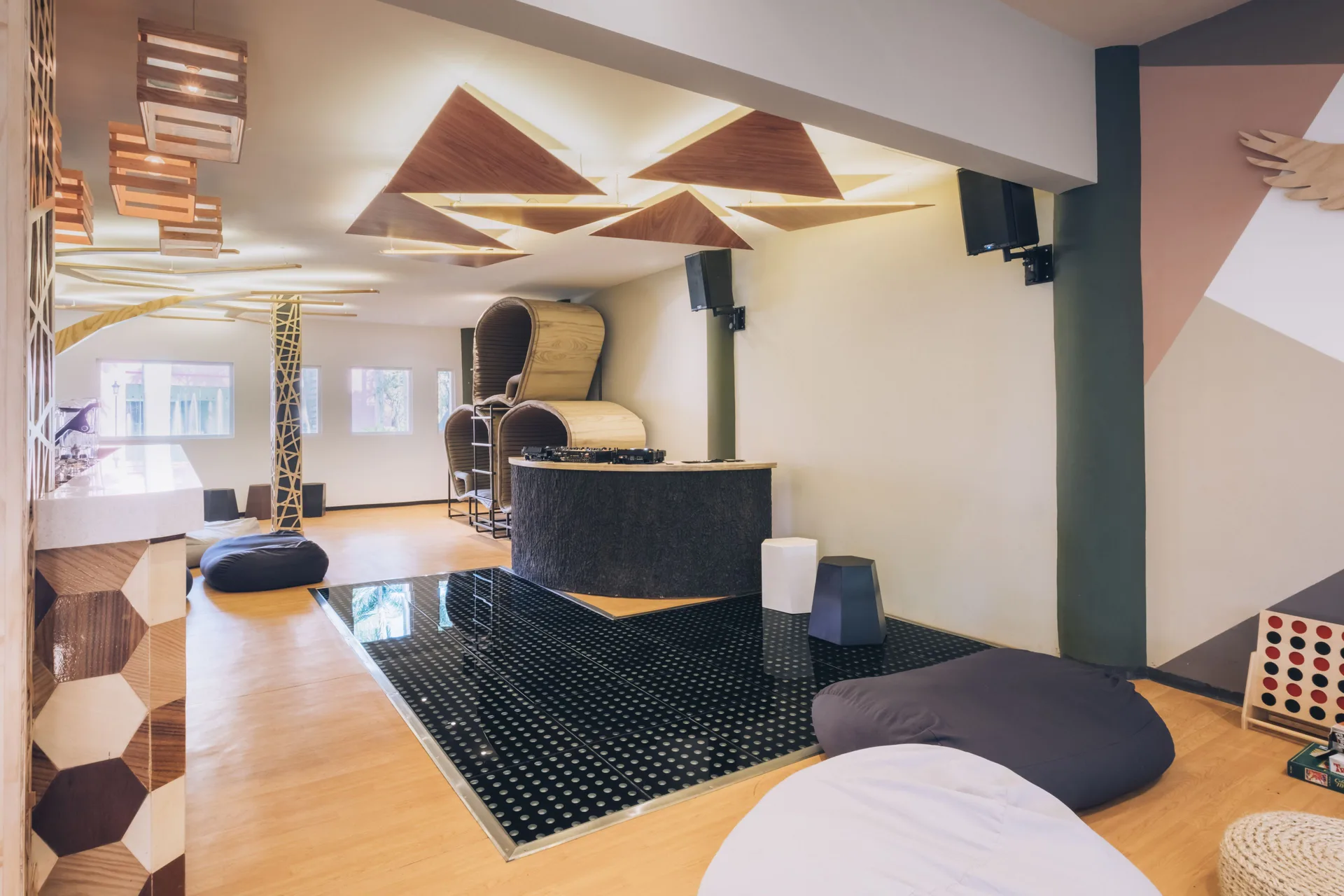 Youth lounge with DJ booth and beanbag seating at Iberostar Selection Paraíso Maya Suites.