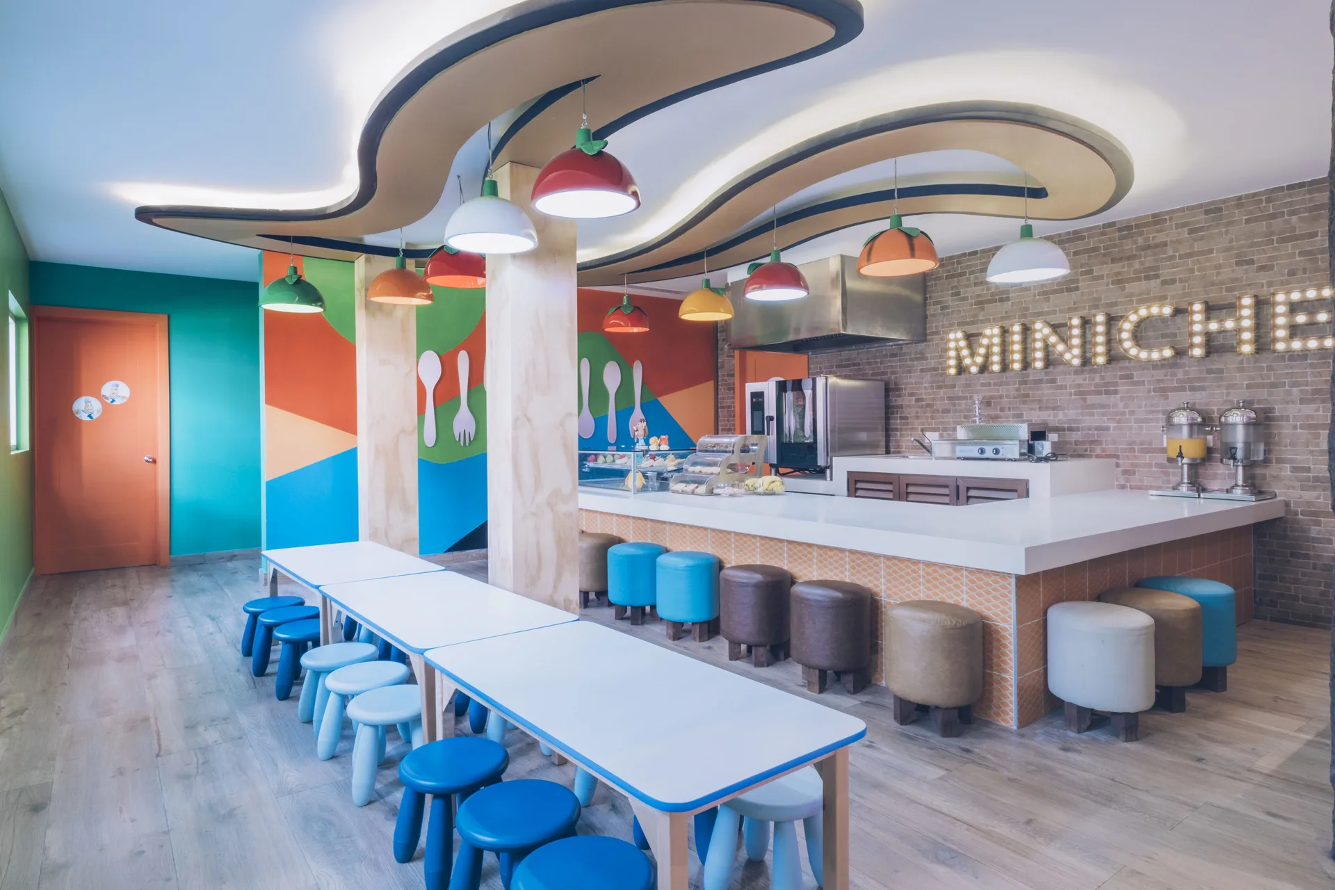 Colorful kids snack room with tables and counter at Iberostar Selection Paraíso Maya Suites.