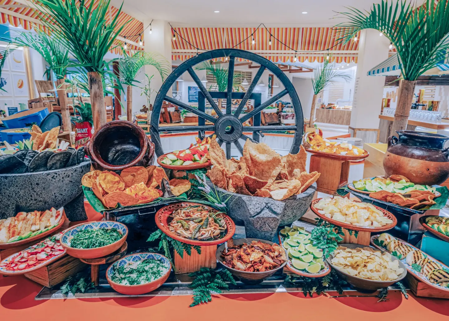 Mexican buffet spread with chips, limes, and salsas at Iberostar Selection Paraíso Maya Suites.