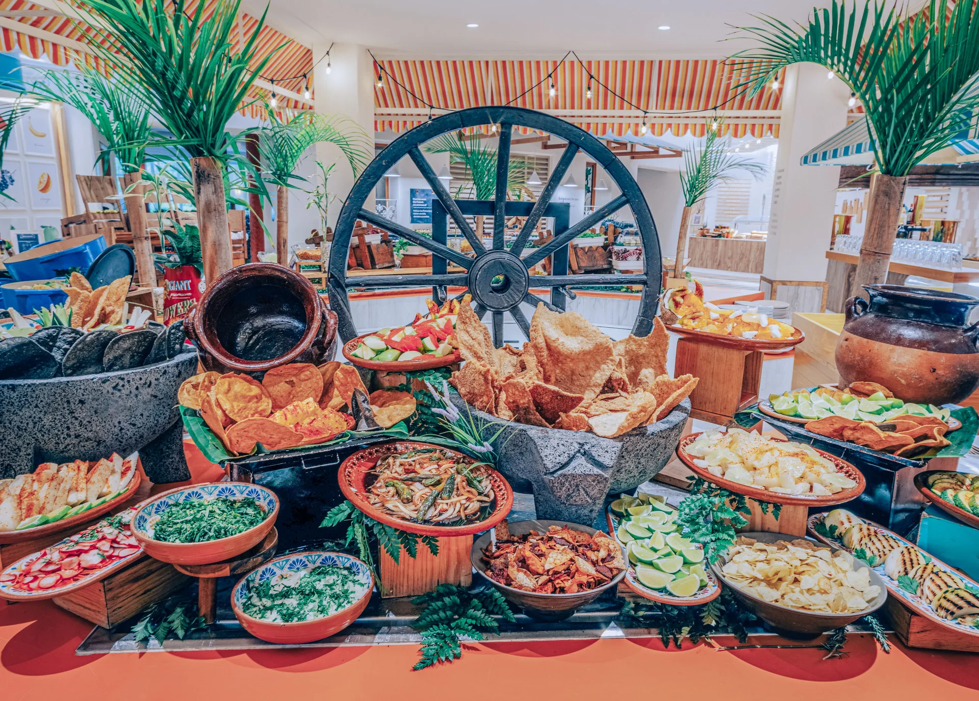 Mexican buffet spread with chips, limes, and salsas at Iberostar Selection Paraíso Maya Suites.