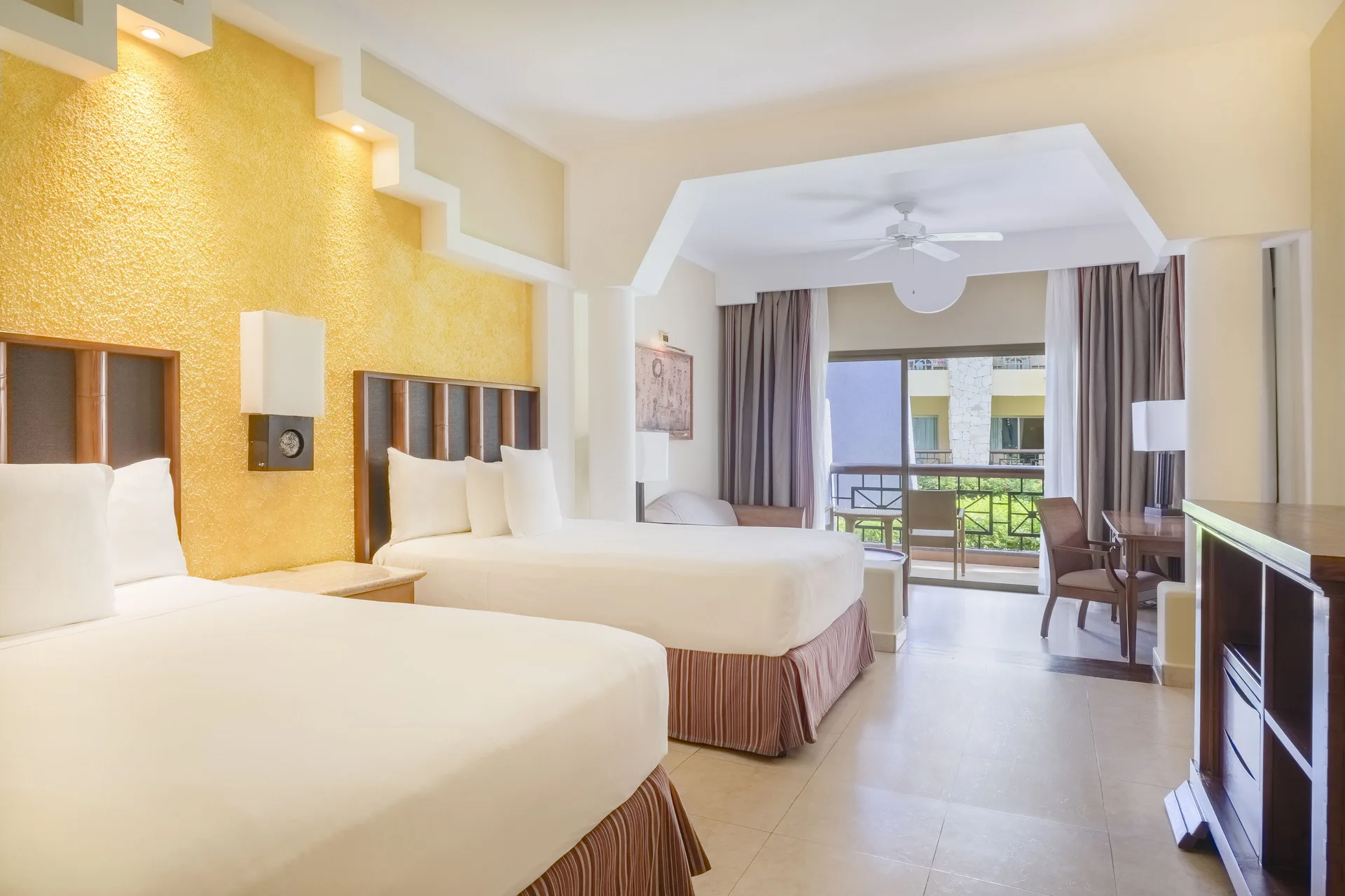Junior Suite with two beds and balcony at Iberostar Selection Paraíso Maya Suites.