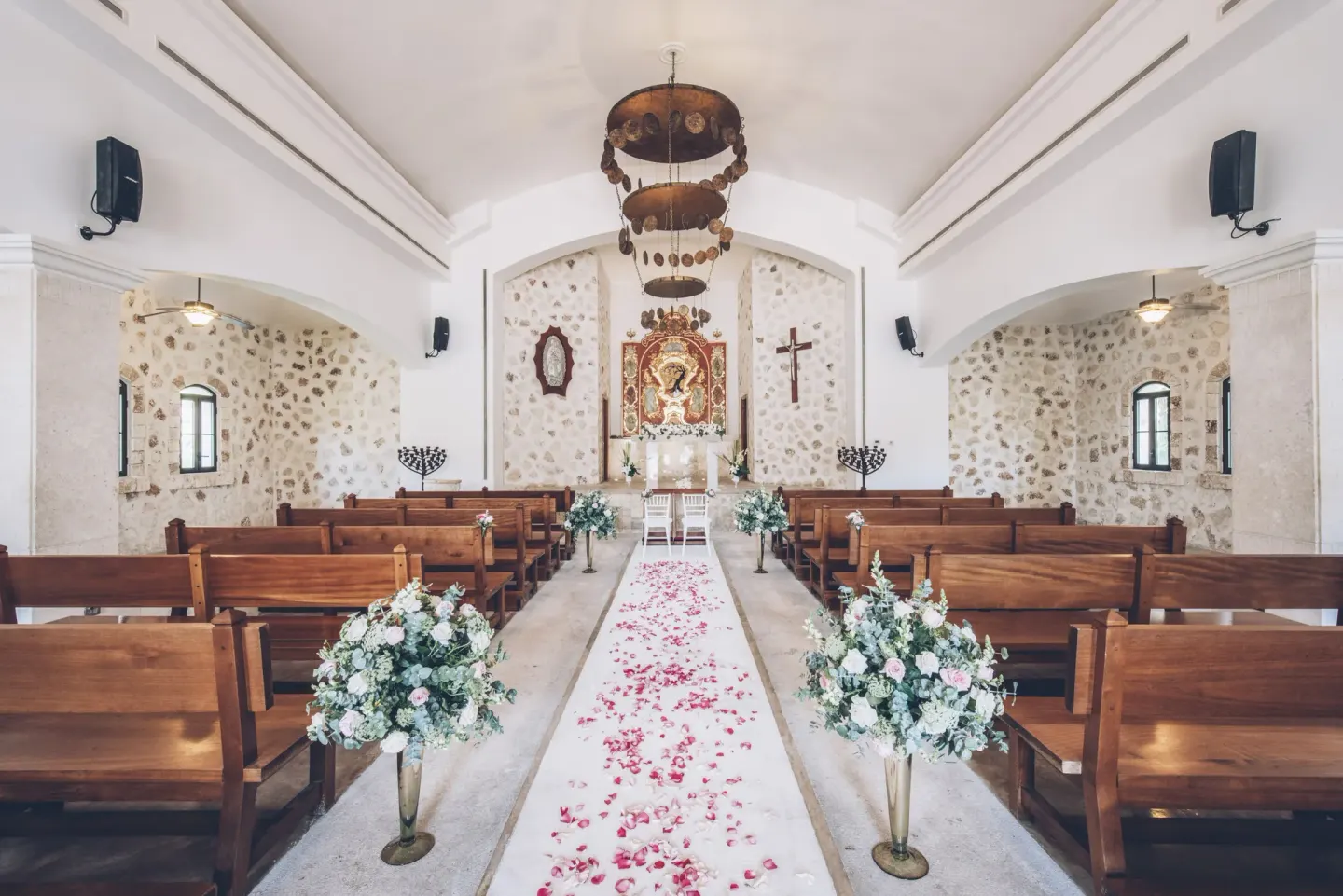 Wedding chapel aisle with flowers at Iberostar Selection Paraíso Maya Suites.