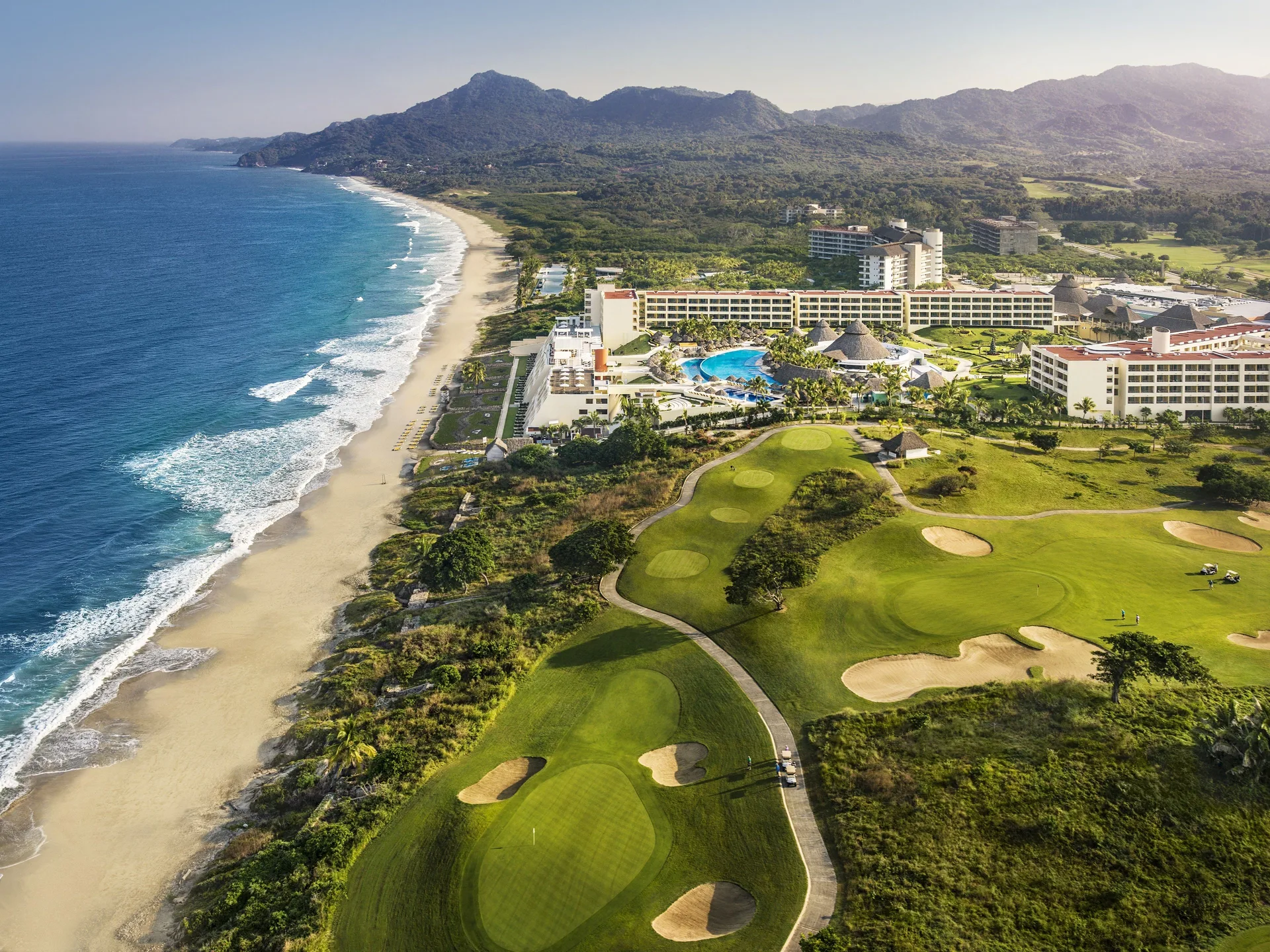 Aerial view of Iberostar Selection Playa Mita beside the beach and golf course.