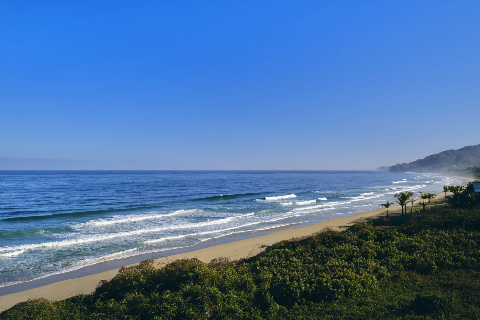 Wide ocean and sandy beach coastline near Iberostar Selection Playa Mita.