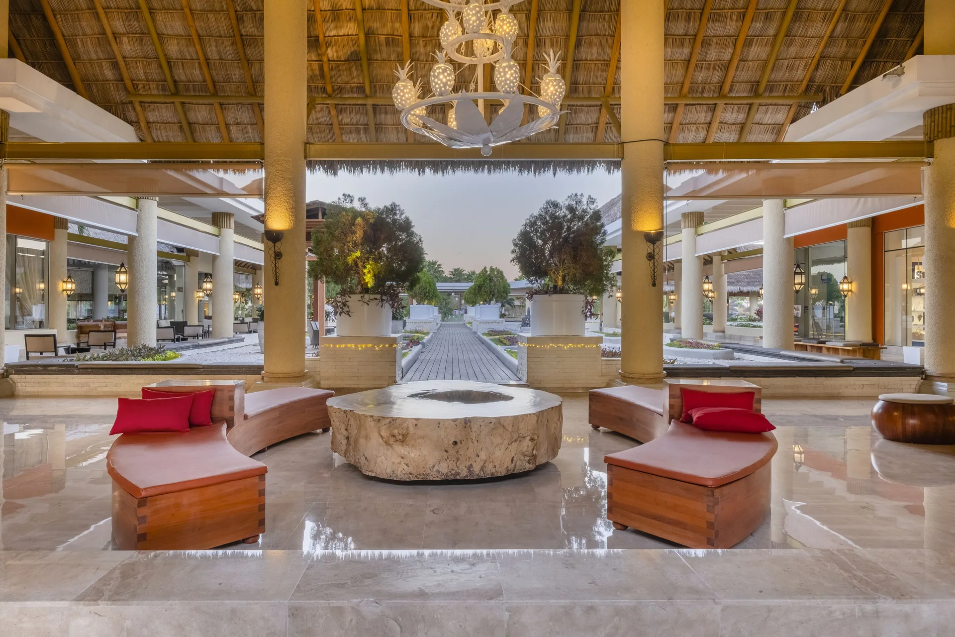 Lobby seating area opening to an outdoor walkway at Iberostar Selection Playa Mita.