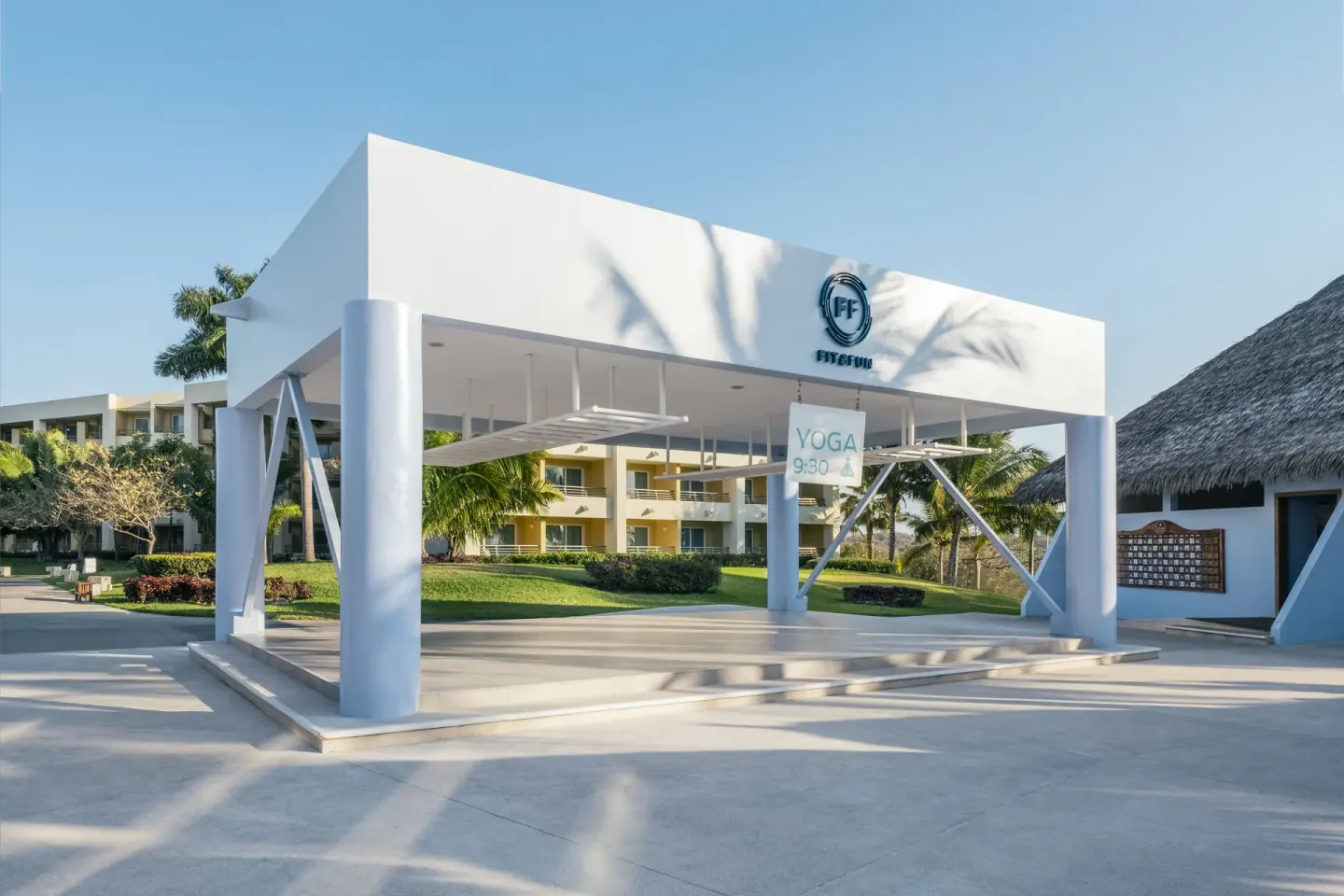 Outdoor fitness pavilion with a yoga sign at Iberostar Selection Playa Mita.