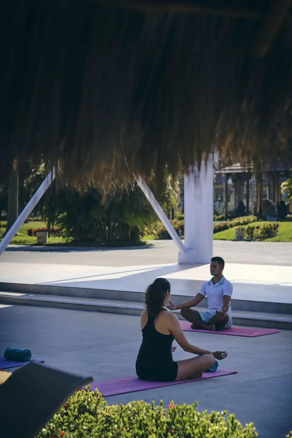 Outdoor yoga class under a palapa at Iberostar Selection Playa Mita.