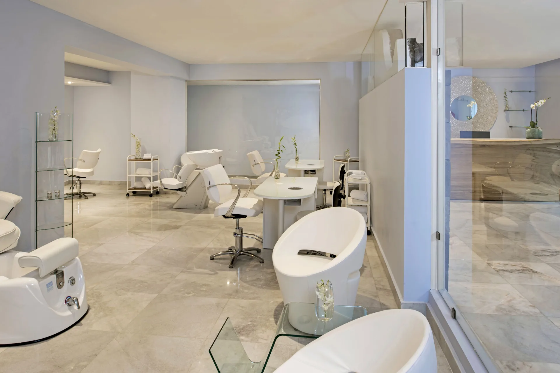 Bright spa salon with pedicure chairs and treatment stations at Iberostar Selection Playa Mita.